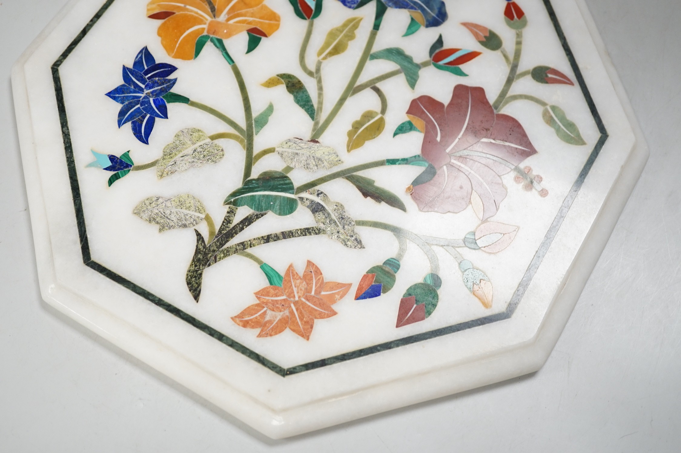 An Agra hardstone inlaid table top. 30cm wide